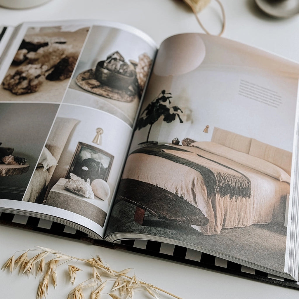 In a captivating photo, the book Create: At Home with Old & New is seen open on a table, presenting a wealth of creative interior design concepts.