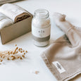Ela Life essential oil bath salts and a calm washcloth form The Organic Company in front of an open byFoke Maeve gift box.