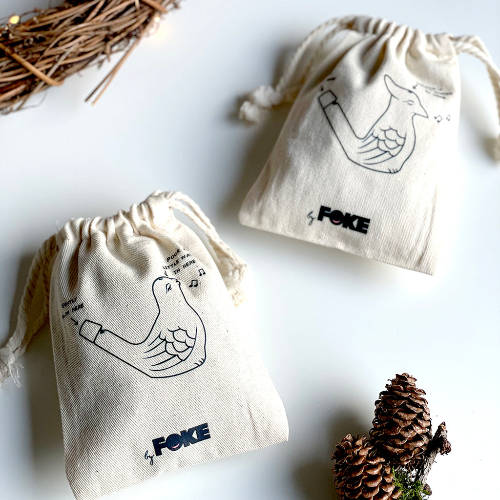 Ceramic Bird Whistle in an Organic Drawstring Bag with an illustration of the bird on the bag