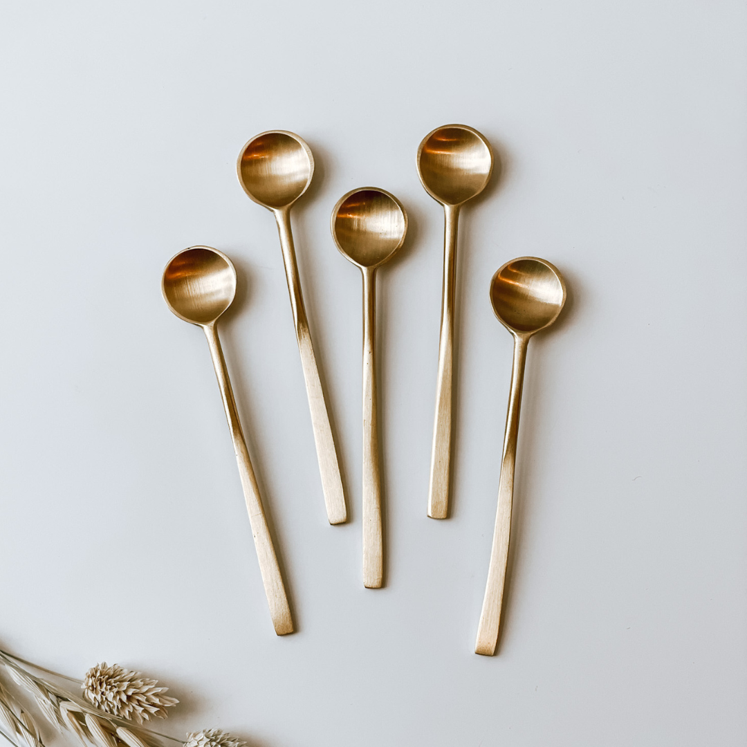 Small brass spoons
